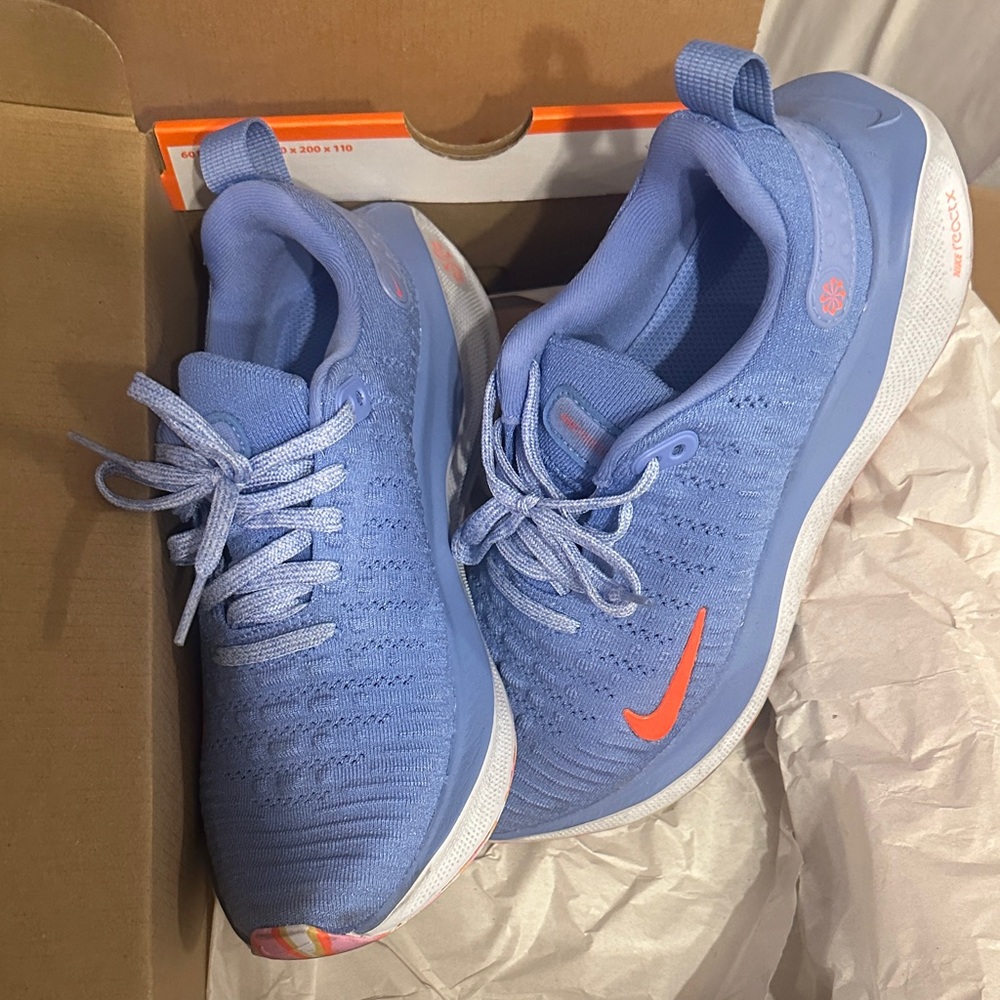 Nike Women’s Light Blue Knit Running Sneakers with Orange Swoosh